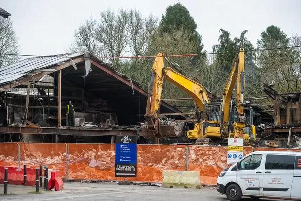 Demolition work begins after businesses hit by devastating fire