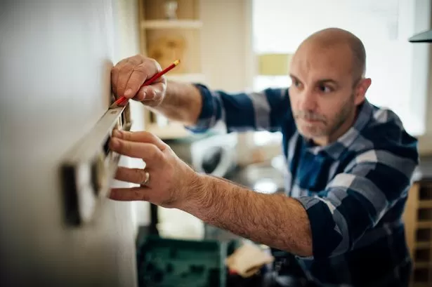 Man breaks down kitchen tiles is floored after seeing what's behind wall