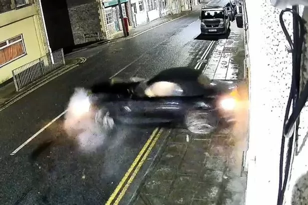 Car spins out of control and collides with house