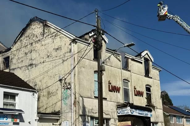 Emergency services at scene as rips through abandoned building - live updates