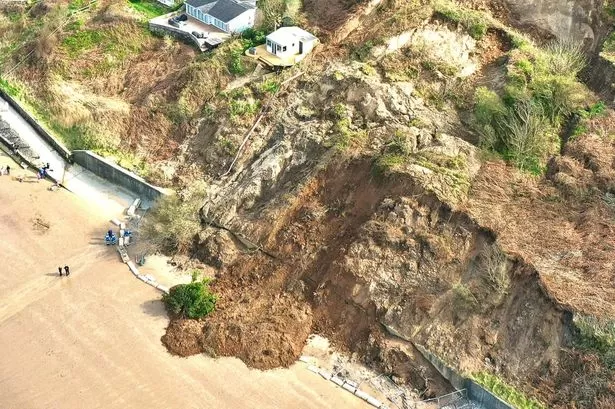 Police at scene of huge beach landslide and public told to 'stay well away'