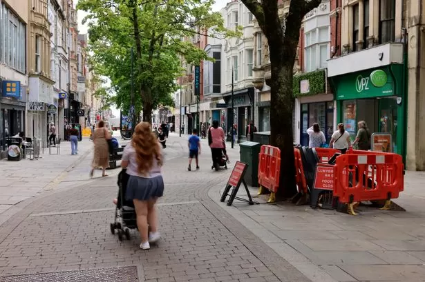Armed police descend on city centre before two men arrested